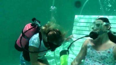 Scuba woman tied in chair underwater - drtuber