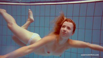 In The Indoor Pool, A Stunning Girl Swims - upornia